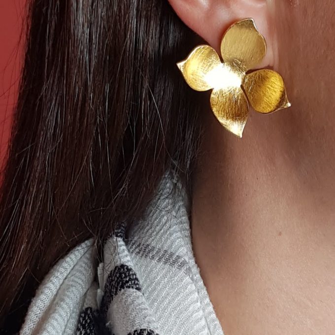Gold flower statement earrings discount