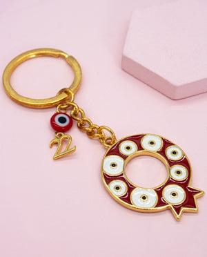 
                
                    Load image into Gallery viewer, Pomegranate Eye Charm (Gouri) Keychain 2022
                
            